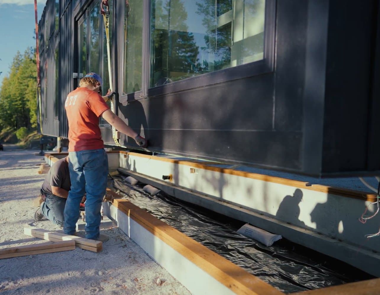 Montera Homes factory build — exterior sheathing and weather barrier application