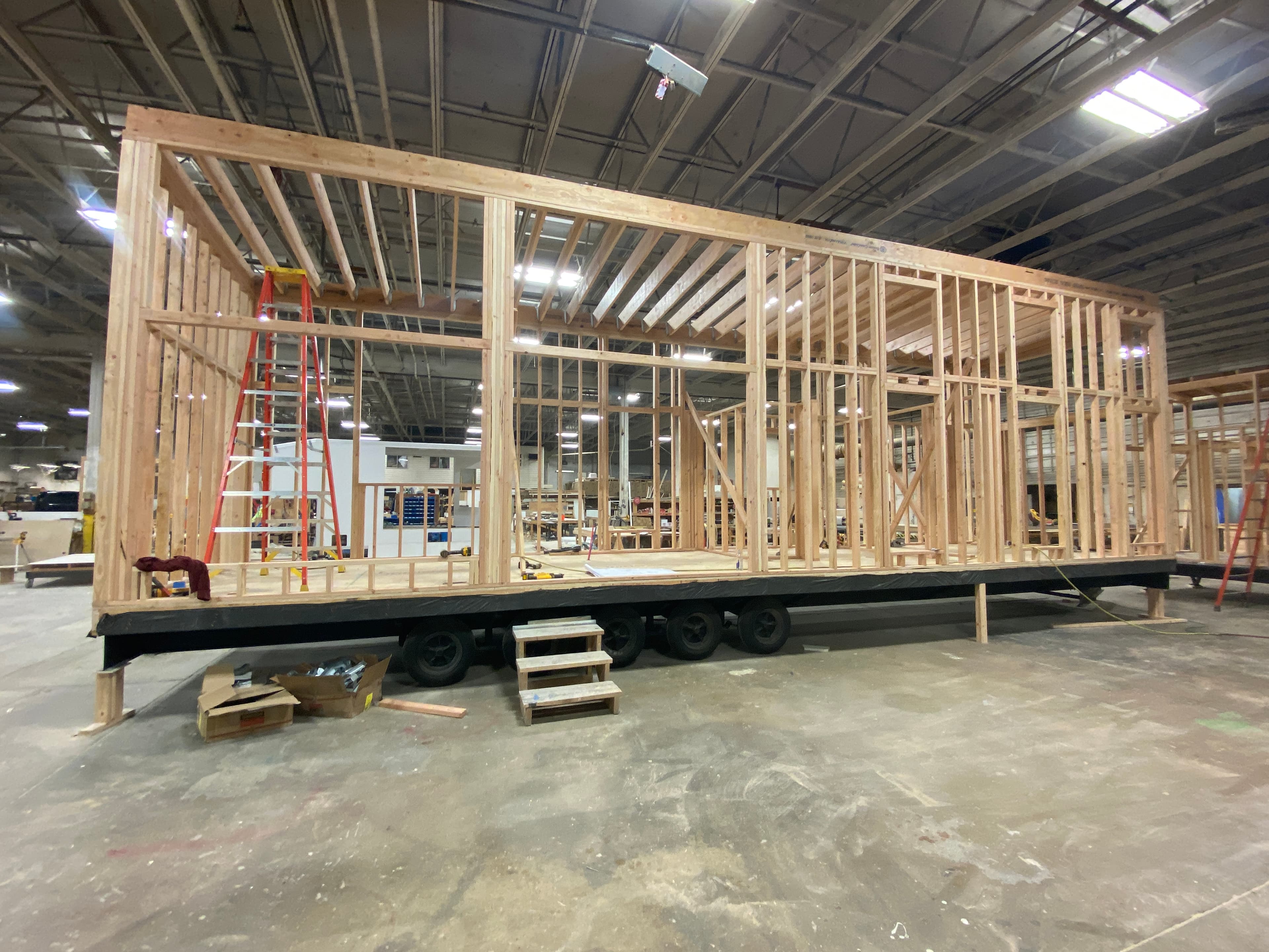 Montera Homes factory build — flooring installation in modular home unit