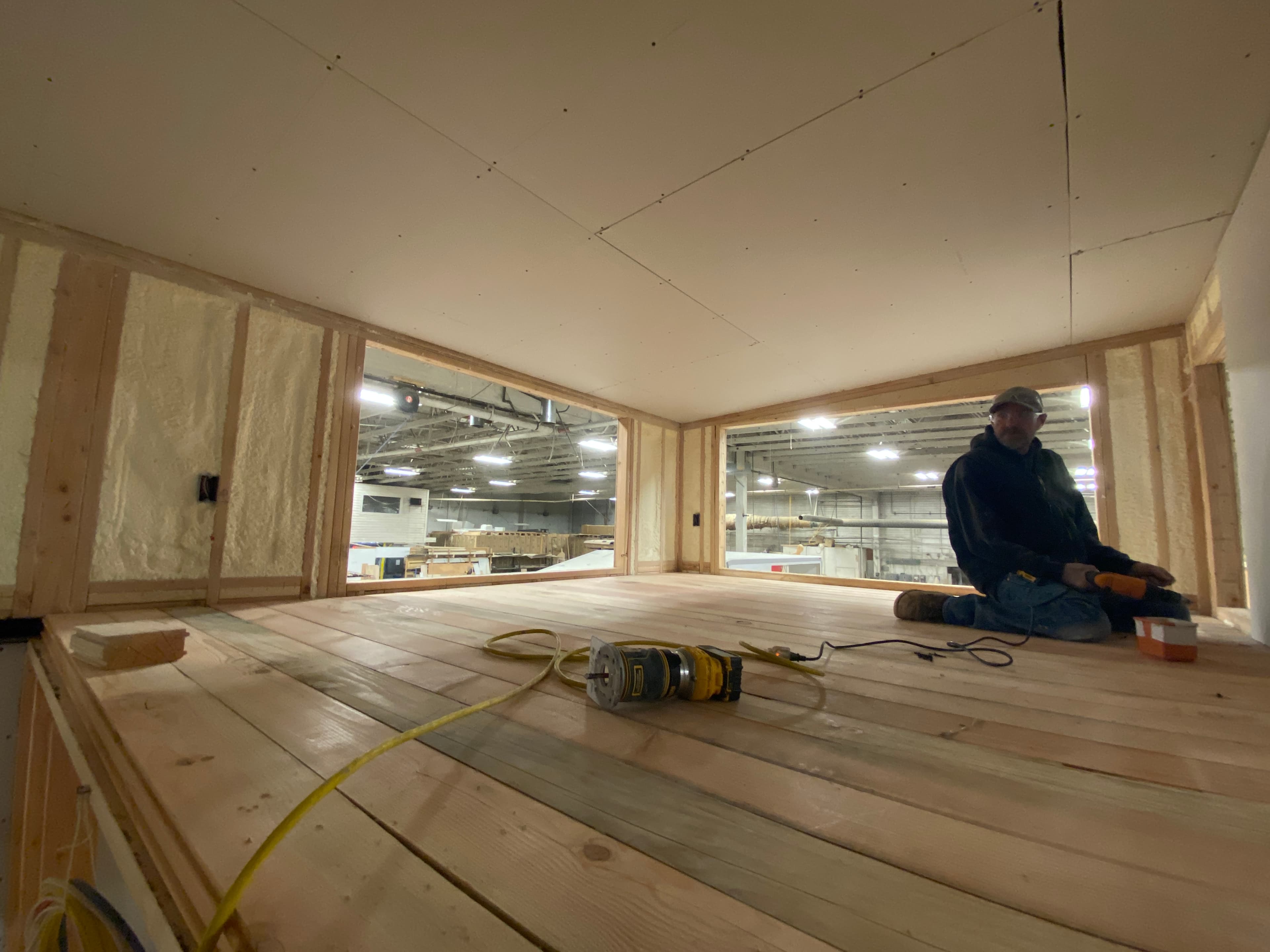 Montera Homes factory build — standing-seam metal roof installation