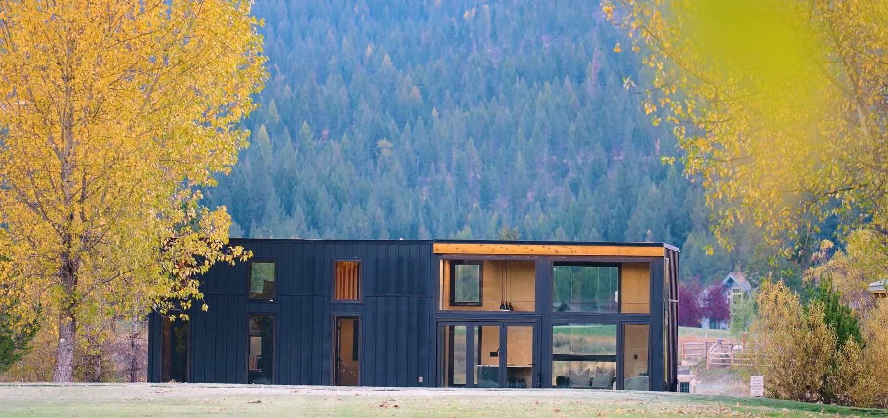 Montera Borah exterior — compact modular home with covered entry and mountain backdrop