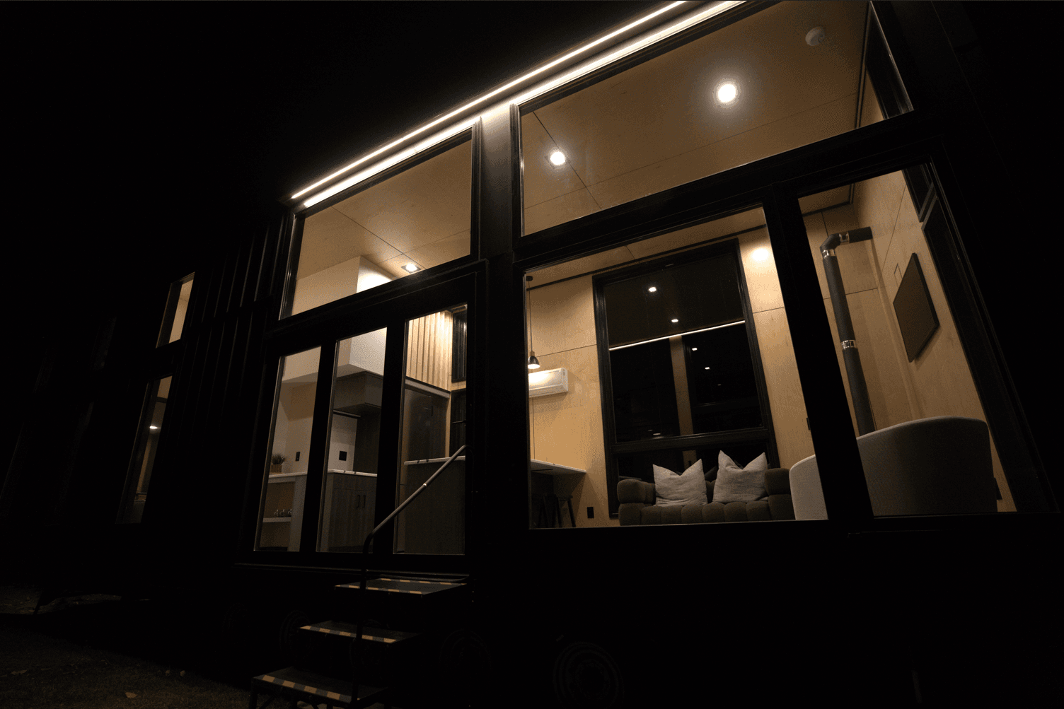Montera modular home rendering — board and batten exterior with accent lighting