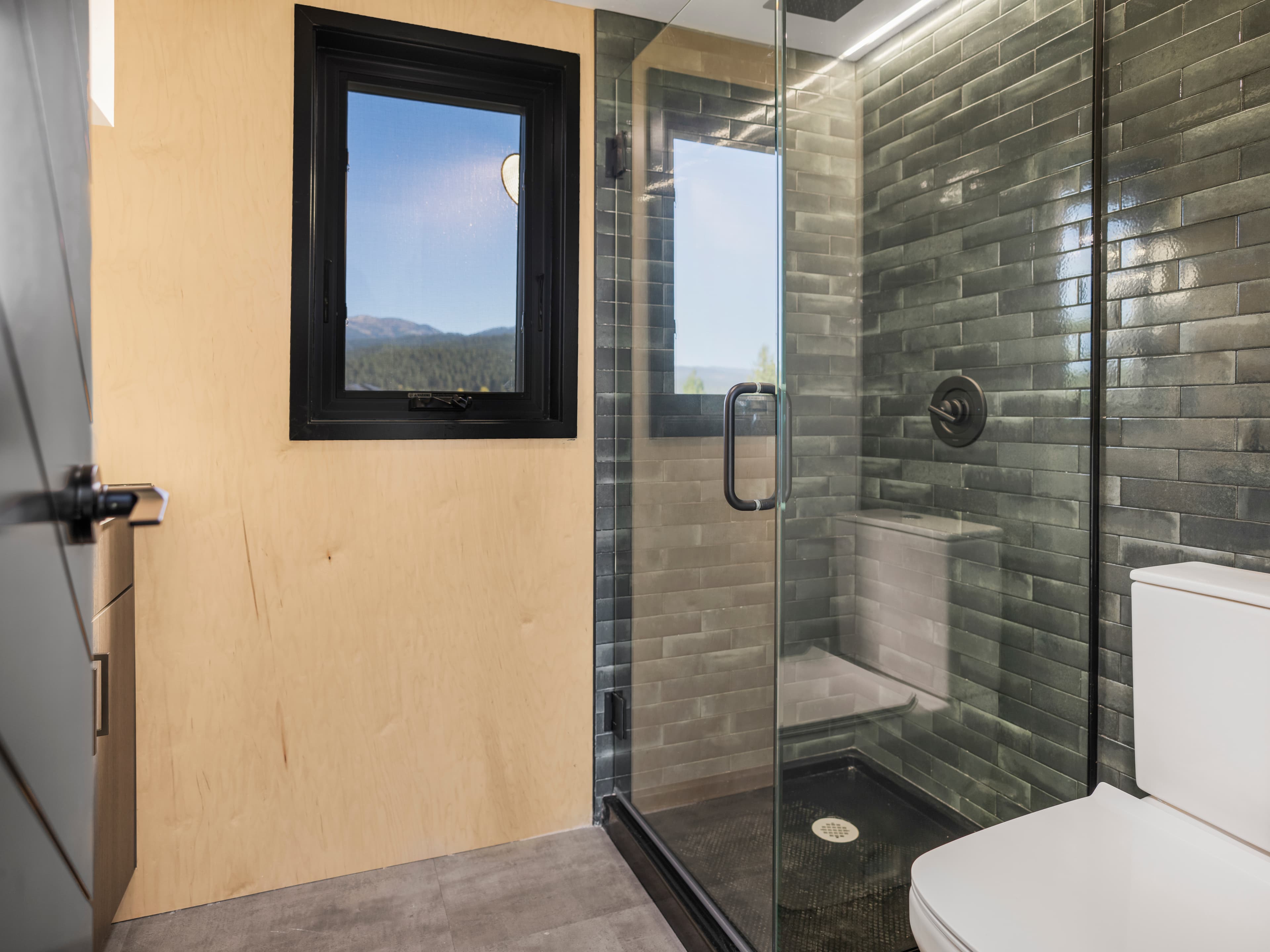 Montera Homes luxury interior — LVP flooring and collapsible primary door