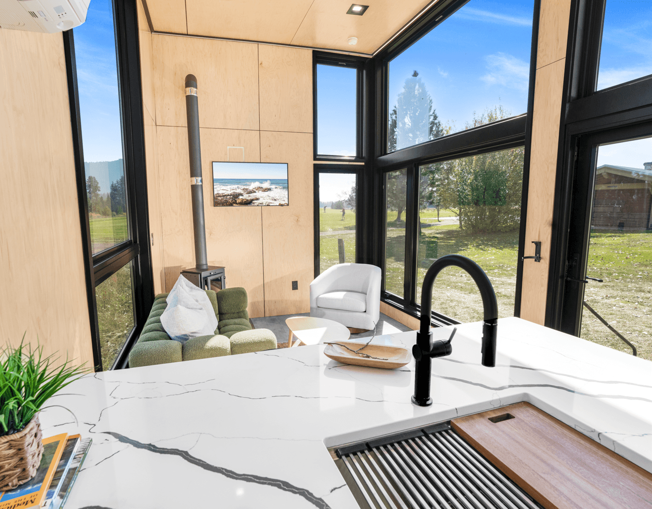 Montera Homes interior rendering — modern kitchen with peninsula and seating