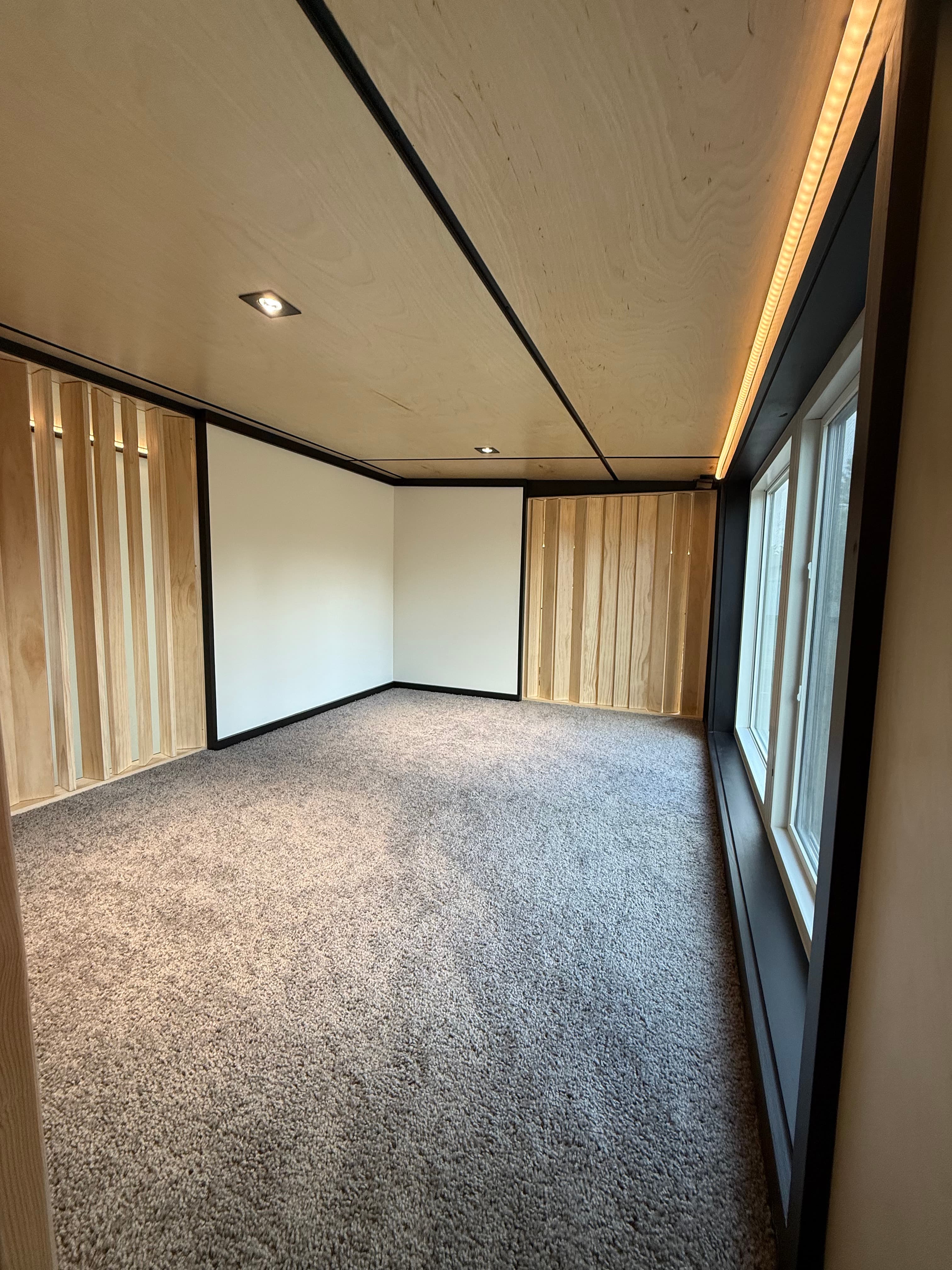 Montera modular home interior — bedroom with neutral carpet and natural light